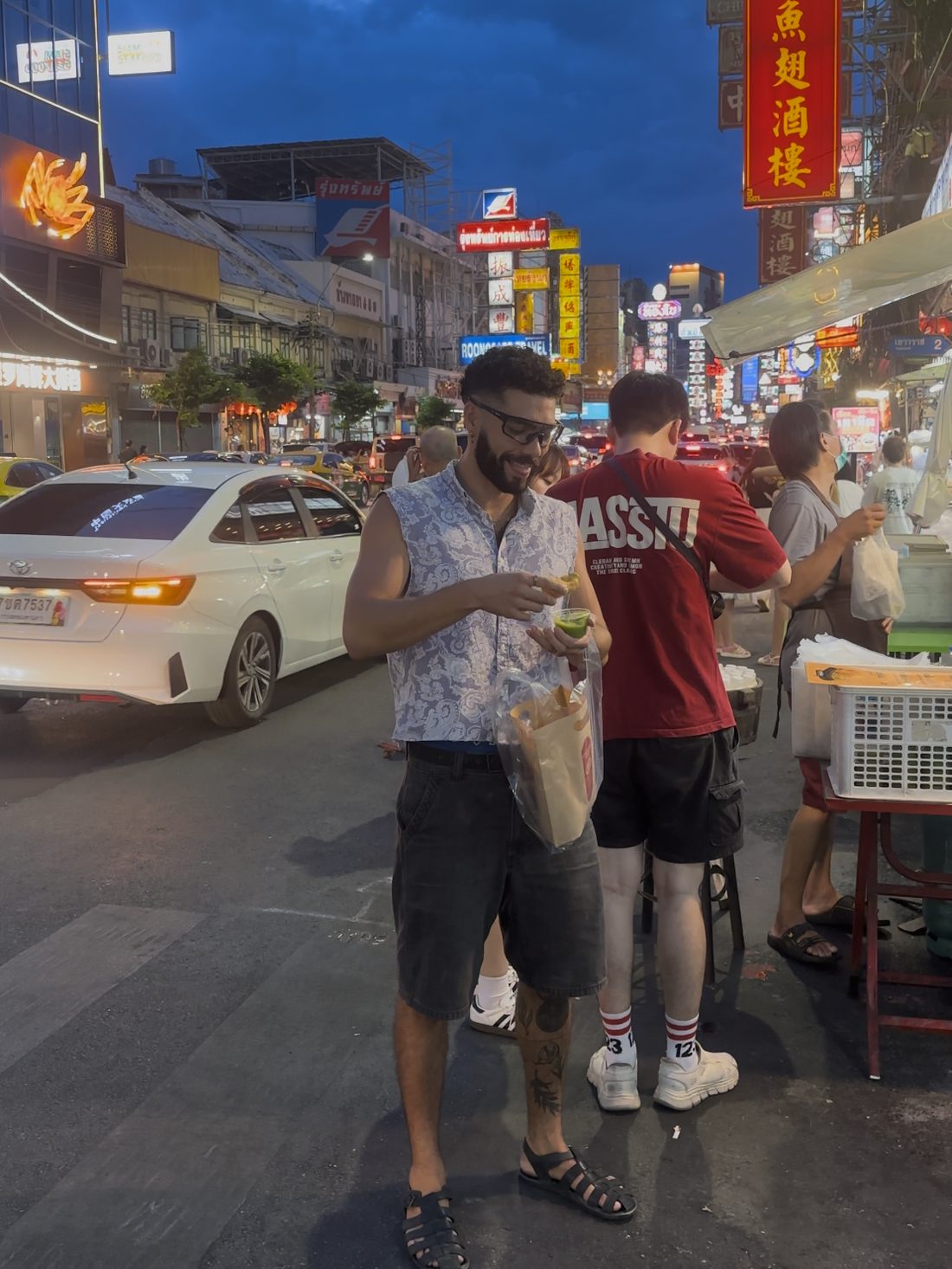 Eithan tasting street food in Bangkok's Chinatown