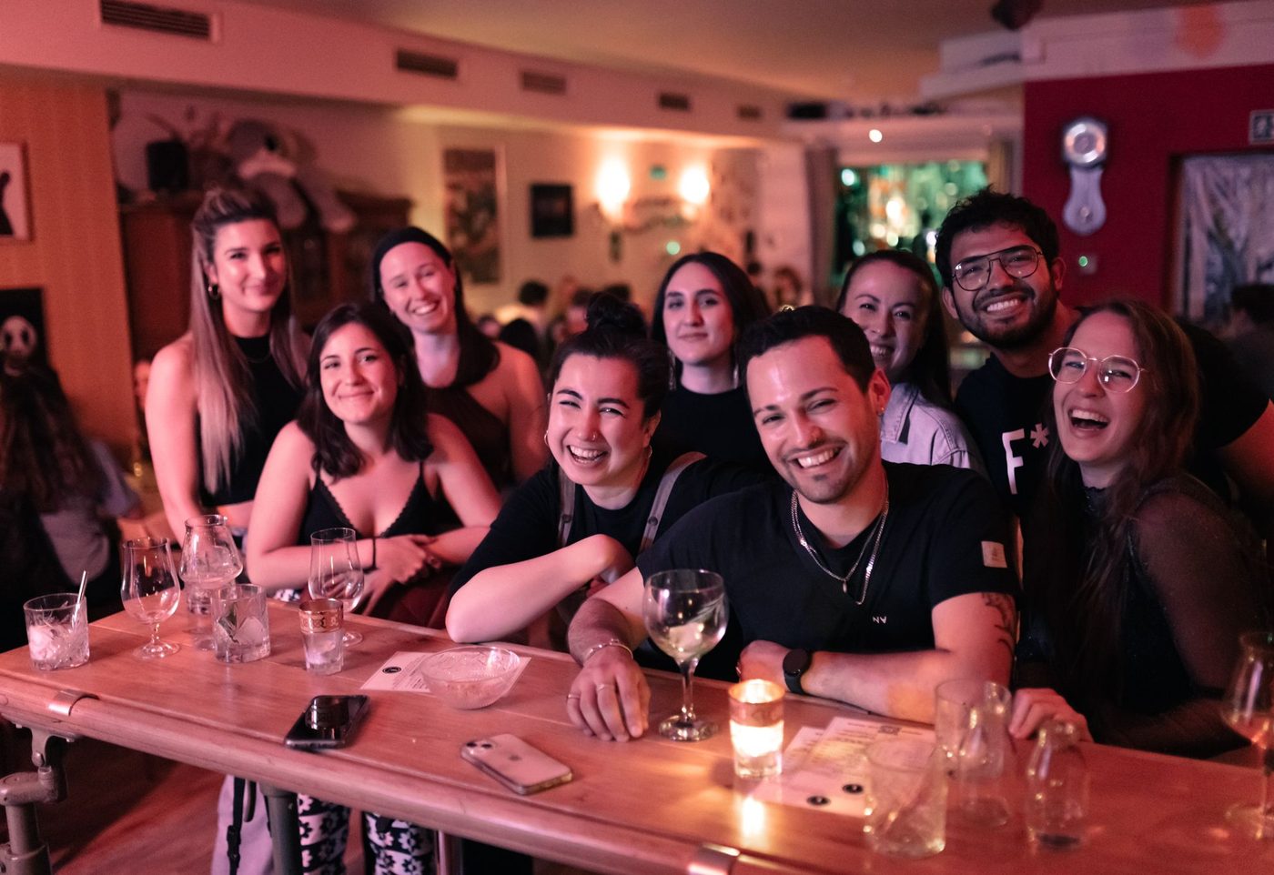 Guests laughing together at the bar of TheBär in Cologne